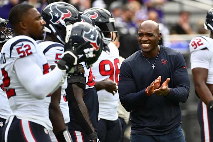 Houston Texans coach DeMeco Ryans encouraging his players on the sideline.
